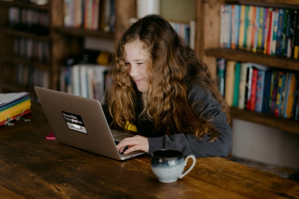 Teen looking at a laptop screen
